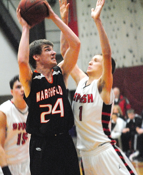 Marshfield's Alex Strege goes up for a shot attempt against Stevens Point's Sam Griffith during Tuesday's Wisconsin Valley Conference boys basketball game at Stevens Point Area Senior High. SPASH won 51-49. (Photo by Paul Lecker/MarshfieldAreaSports.com)