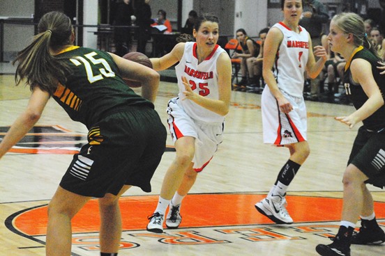 Marshfield's Ema Fehrenbach drives through the D.C. Everest defense during the Tigers' win on Tuesday night at Marshfield High School. (Photo by Paul Lecker/MarshfieldAreaSports.com)