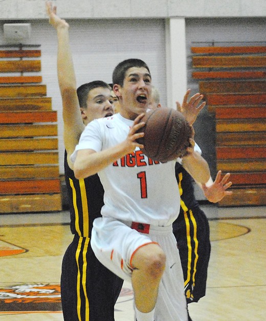 Marshfield's Ethan Posteluk drives to the basket during the first half of the Tigers' loss to Wausau West on Friday at Marshfield High School. (Photo by Paul Lecker/MarshfieldAreaSports.com)