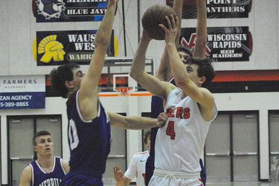 Marshfield's Tyson Slade puts up a shot surrounded by the Merrill defense during the Tigers' win Friday night at Marshfield High School. (Photo by Paul Lecker/MarshfieldAreaSports.com)