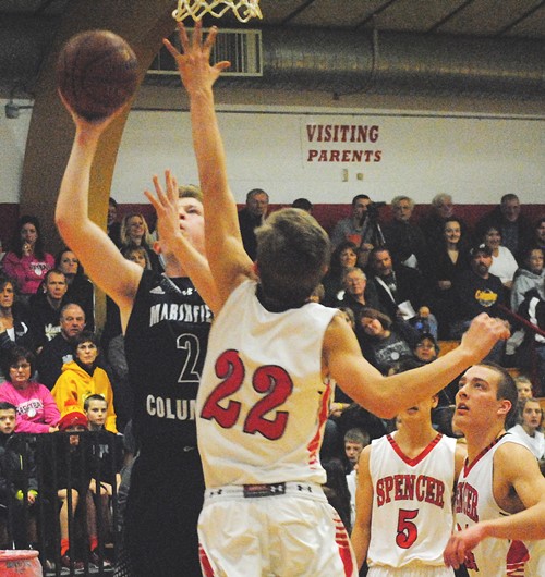 Marshfield Columbus Catholic's Billy Young drives to the basket during the Dons' 80-66 win over Spencer on Thursday night at Spencer High School. (Photo by Paul Lecker/MarshfieldAreaSports.com)