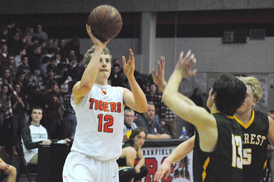 Marshfield's Alec Hinson knocks down a floater during the first half of the Tigers' 71-61 win over D.C. Everest on Friday night at Marshfield High School. (Photo by Paul Lecker/MarshfieldAreaSports.com)