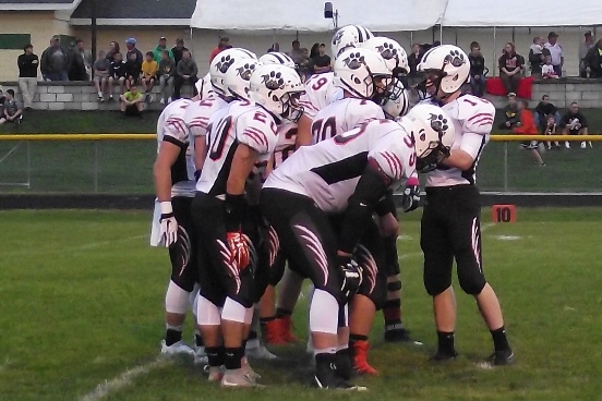 Stratford's offense huddles up early in the game at Edgar on Friday night. The Tigers won 7-6 to improve to 3-0 in the Marawood Conference. (Photo by Steve Pilz/For MarshfieldAreaSports.com)