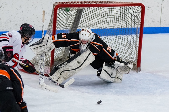 Marshfield goalie Haydon Roy-Peterson makes a save on a shot from Stevens Point's Trevor Zinda during the Tigers' game at Stevens Point on Tuesday. (Photo by Ron Sievers/RSpix, for MarshfieldAreaSports.com)